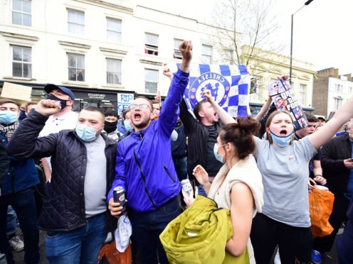 Chelsea fans stage an anti-Super League protest outside Stamford Bridge (Ian West/PA)