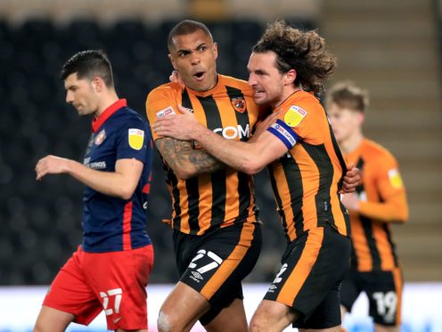 Josh Magennis, left, celebrates his second vital equaliser (Mike Egerton/PA)