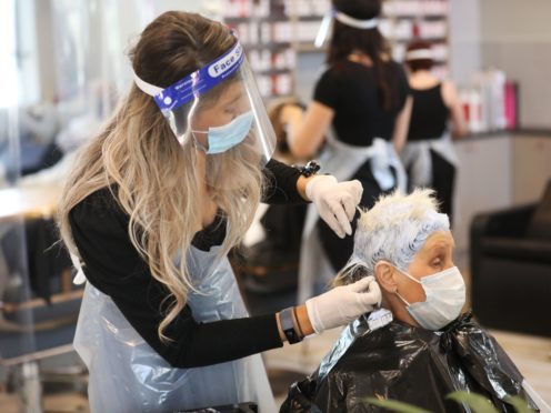 Lorraine Calvert gets her hair done by Laura Stevenson at Natural Hair Company, Lisburn (Peter Morrison/PA)