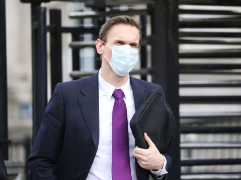 Television presenter Dr Christian Jessen leaves Belfast High Court after giving evidence in defamation proceedings taken against him by First Minister Arlene Foster (Peter Morrison/PA)