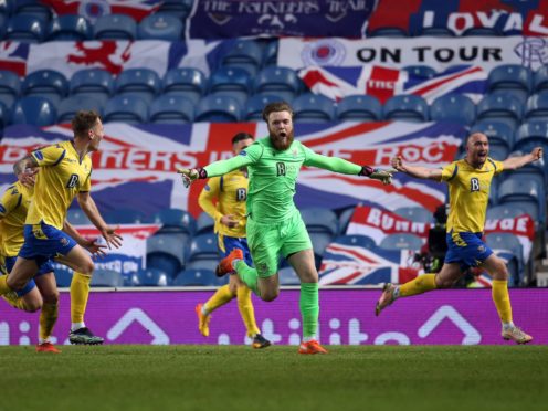 Zander Clark celebrates the equaliser (Andrew Milligan/PA)
