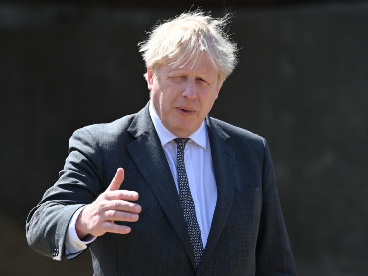 Prime Minister Boris Johnson during a visit to Moreton farm in Clwyd near Wrexham, North Wales, as part of Welsh the Conservative Party’s Senedd election campaign (Paul Ellis/PA)