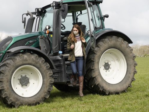The Duchess of Cambridge steps from a tractor during a visit to Manor Farm in Little Stainton, Durham (Owen Humphreys/PA)