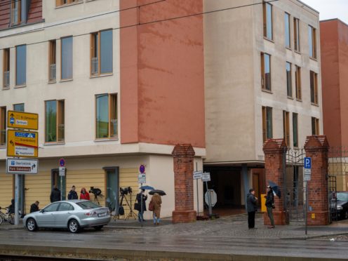 Journalists wait outside the clinic in Potsdam, Germany (Christophe Gateau/AP)