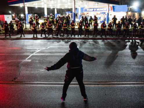 A demonstrator heckles authorities in Minneapolis (AP)