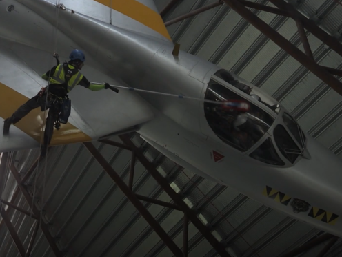 A worker cleans one of the planes (PA)