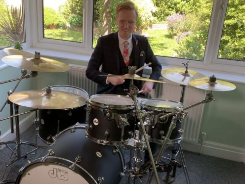 BBC weather presenter Owain Wyn Evans on the drums (BBC)