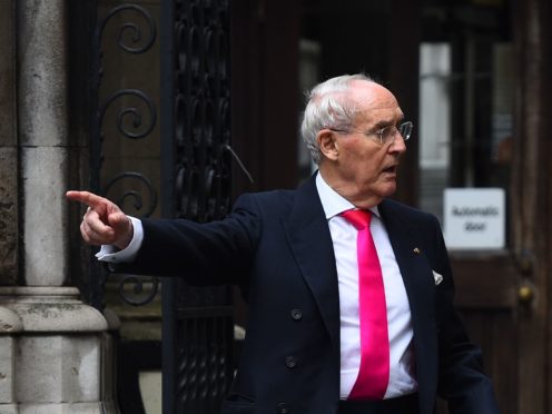 Sir Frederick Barclay (left) leaves the High Court in London, after a preliminary hearing in his row over money with Lady Hiroko Barclay (Kirsty O’Connor/PA)