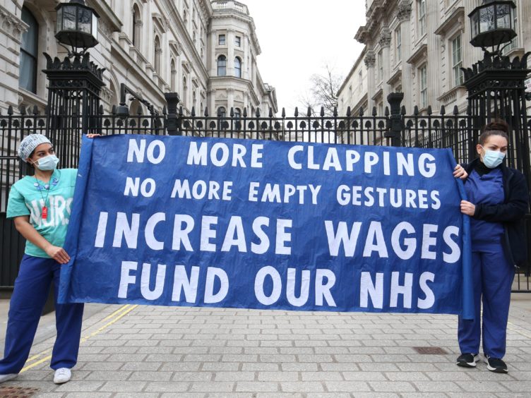 Health staff hold a protest over the proposed 1% pay rise (Jonathan Brady/PA)