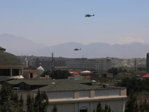 US Black Hawk military helicopters fly over the Afghan capital (AP)