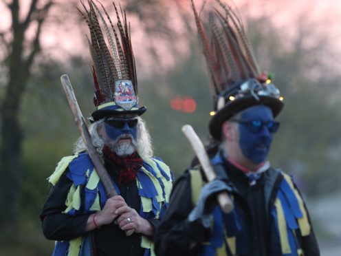 The Hook Eagle Morris Men are wearing blue face paint for the first time (Andrew Matthews/PA)