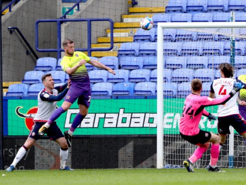 Exeter defender Pierce Sweeney (left) scores his side’s winning goal at Bolton (Tim Markland/PA)