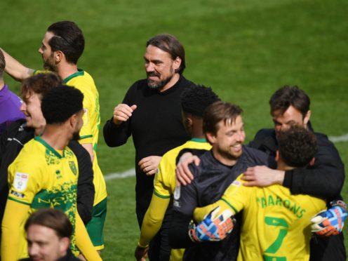 Daniel Farke celebrates with his players after Norwich were crowned champions (Joe Giddens/PA)