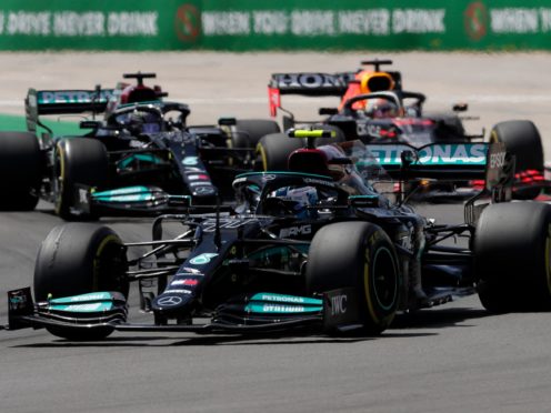 Hamilton (left) got the better of Bottas and Verstappen (AP Photo/Manu Fernandez)