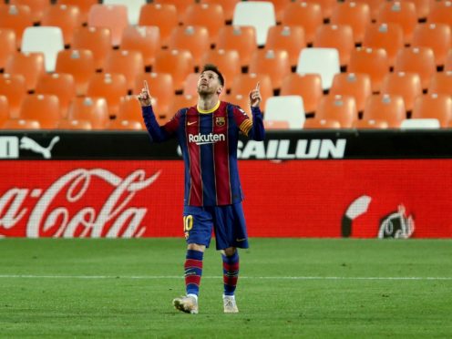 Barcelona’s Lionel Messi celebrates scoring against Valencia (Alberto Saiz/AP).