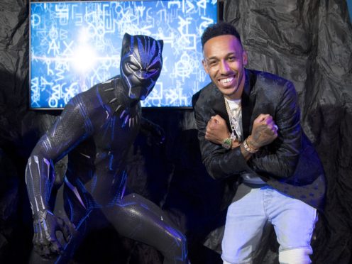 Black Panther is the latest superhero to be given the waxwork treatment at Madame Tussauds in London, and the figure was unveiled with the help of Pierre-Emerick Aubameyang (Ian West/PA)