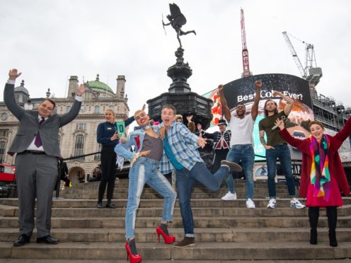 Noah Thomas (front second left), Shane Richie (front centre), Magic Mike stars and Ros Morgan (right), CEO of Heart of London Business Alliance, at Piccadilly Circus (Kirsty O’Connor/PA)