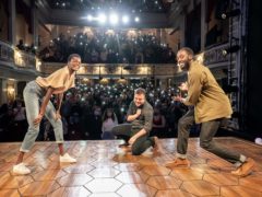 Sheila Atim as Marianne, Ivanno Jeremiah as Roland, and director Michael Longhurst with the audience making Constellations on their phones at the curtain call (Marc Brenner/PA)