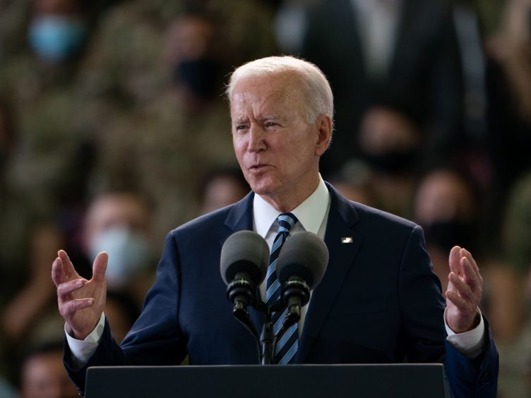 US President Joe Biden addresses US Air Force personnel at RAF Mildenhall (Joe Giddens/PA)