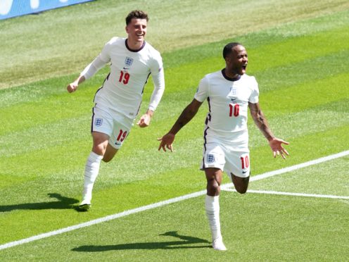 England’s Raheem Sterling celebrates scoring the winning goal (Martin Rickett/PA)