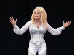 Dolly Parton recreated a Playboy photoshoot from 1978 to surprise her husband for his 79th birthday (Yui Mok/PA)