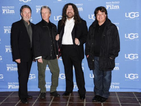 Kansas vocalist and violinist Robby Steinhardt, second from the right, has died aged 71 (Richard Shotwell/Invision/AP, File)