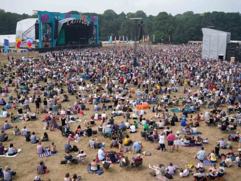 Festivalgoers watch Bill Bailey perform at Latitude Festival (Jacob King/PA)