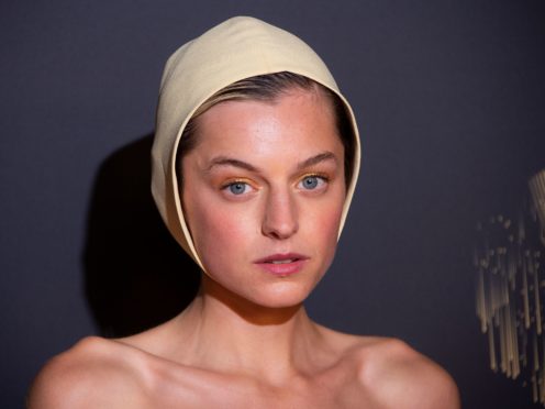 Emma Corrin traded her crown for a bonnet at an Emmys red carpet (Joel C Ryan/Invision/AP)