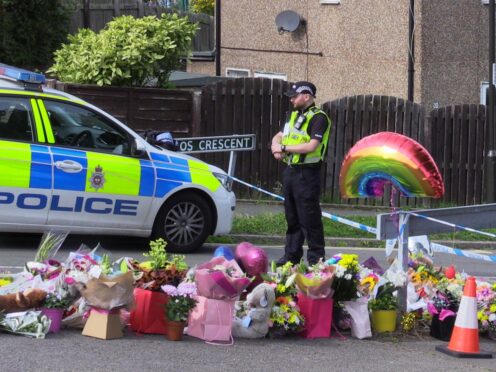 Flowers near to the scene of the murders in Chandos Crescent, Killamarsh, near Sheffield (PA)