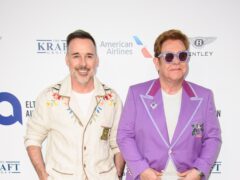 Sir Elton John and David Furnish will receive a joint lifetime achievement award in recognition of their work in music and charity (Matt Crossick/PA)