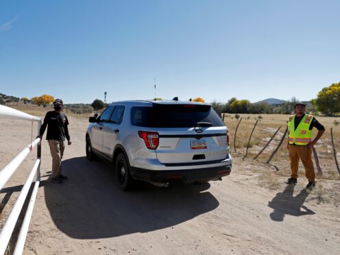 A law enforcement vehicle enters the Bonanza Creek Film Ranch in Santa Fe (Andres Leighton/AP)