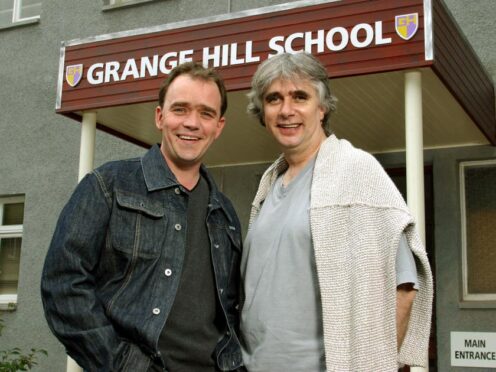 Grange Hill creator Phil Redmond (right) and Todd Carty, who played one of its best loved characters Tucker Jenkins (PA)