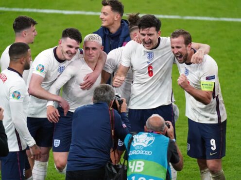 England’s Harry Kane (right) and Harry Maguire celebrate winning the Euro 2020 semi-final match at Wembley Stadium in London on July 7 2021 (Mike Egerton/PA)