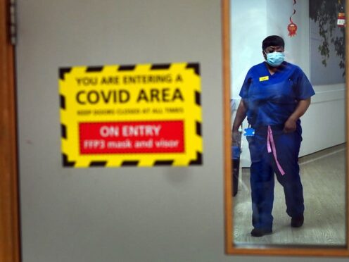 A nurse walks through a Covid ward at King’s College Hospital, London (PA)
