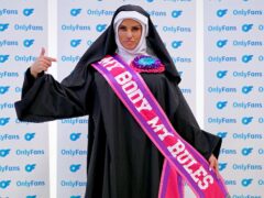 Katie Price dressed as a nun wearing a sash saying ‘My Body My Rules’ during a photocall for her Only Fans website (Ian West/PA)