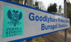 Sign with the name of Goodlyburn Primary School in English and Gaelic