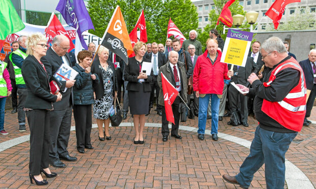 Unite The Unions, Unison and other supporters attend a demonstrate outside Fife House.