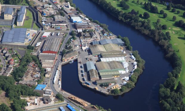 Aerial shot of Perth harbour on River Tay with city surrounding it
