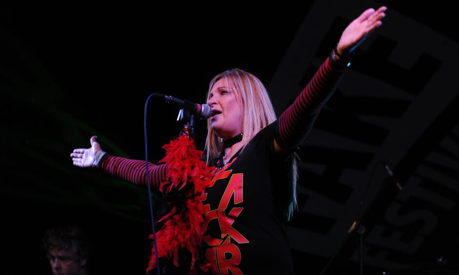 Image shows Cherry Bombz band on stage.