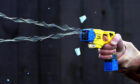 A taser that has been deployed.
