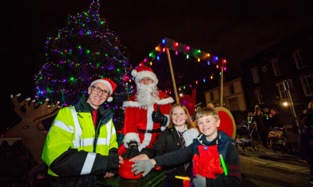 Children with santa at the dundee west end christmas fortnight