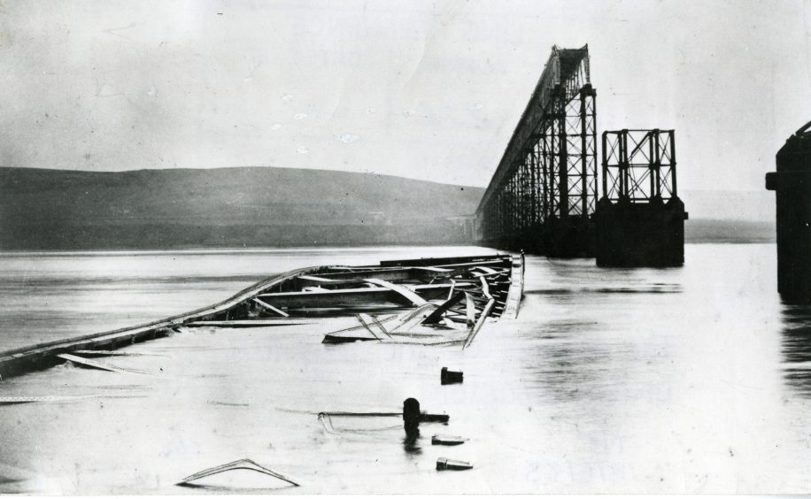 Parts of the Tay Bridge lie in the water and the remaining, intact parts of the bridge are visible in the background