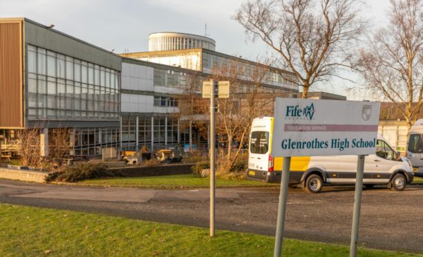 Glenrothes High School building with school sign in foreground