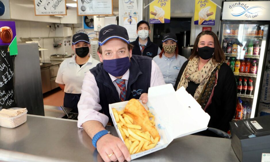 Scott and Shannon Davie with members of staff at Dunkeld Fish Bar.