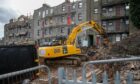 Demolishing the tenement flats on Blackness Road. Image: Kim Cessford/DC Thomson.