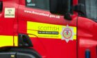 Firefighters were seen battling to control the flames, which were "well established" through the car when they arrived at the scene, south of Fyvie.