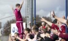 Bobby Linn celebrates with Arbroath fans at Montrose