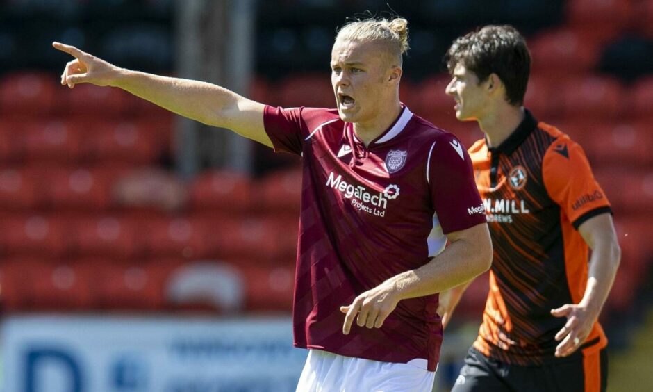 Harrison Clark in action against Dundee United