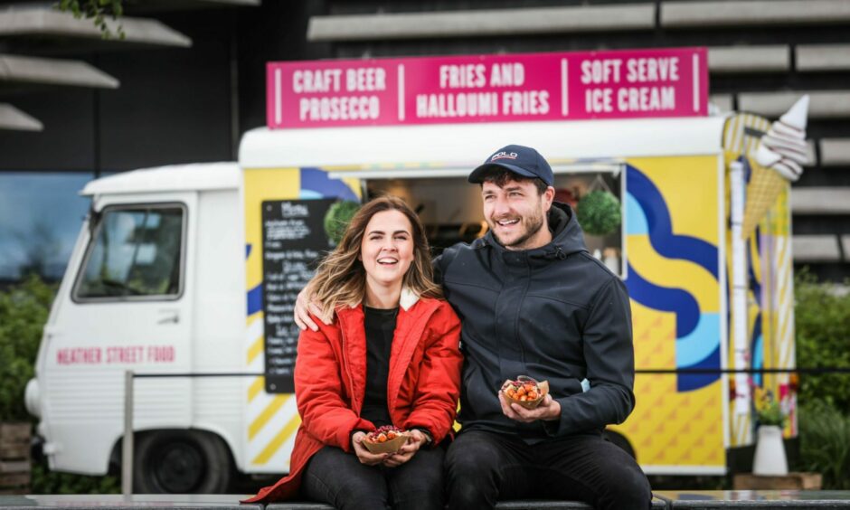 Chris Heather and Melodie Paterson sit outside their Heather Street Food van 