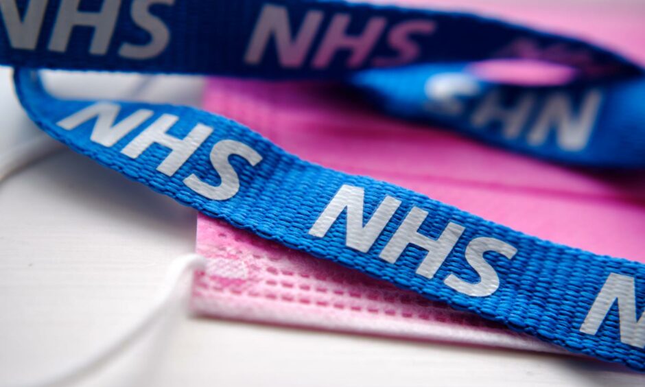 An NHS Fife lanyard and a face mask